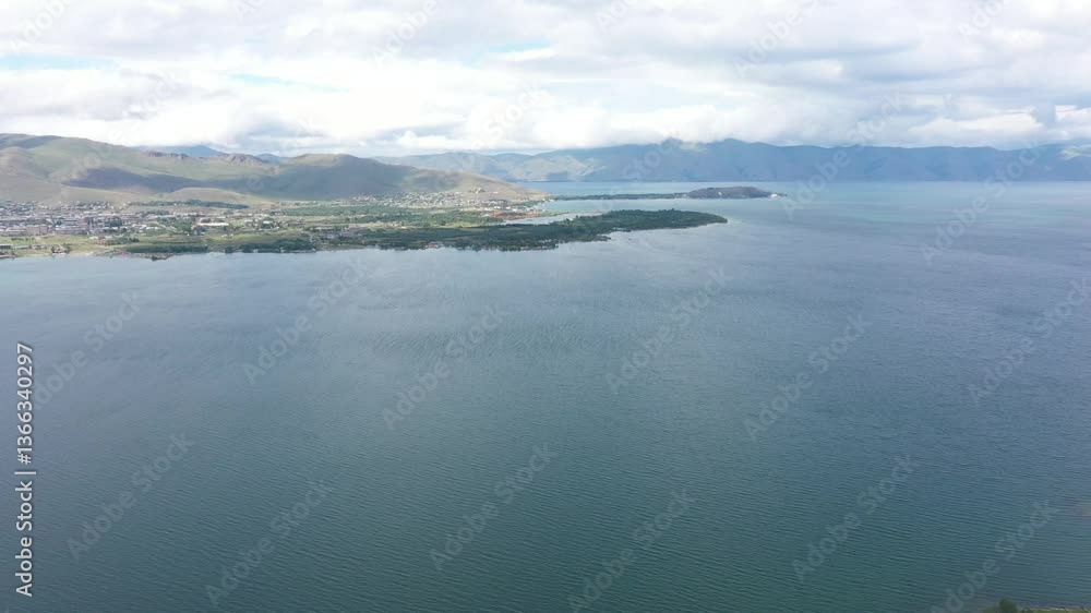 View of an island where homes and settlements harmonize with the natural landscape View of an island where homes and settlements harmonize with the natural landscape