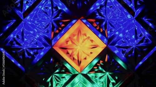 Kaleidoscope made of glass pattern with multi-colored illumination.