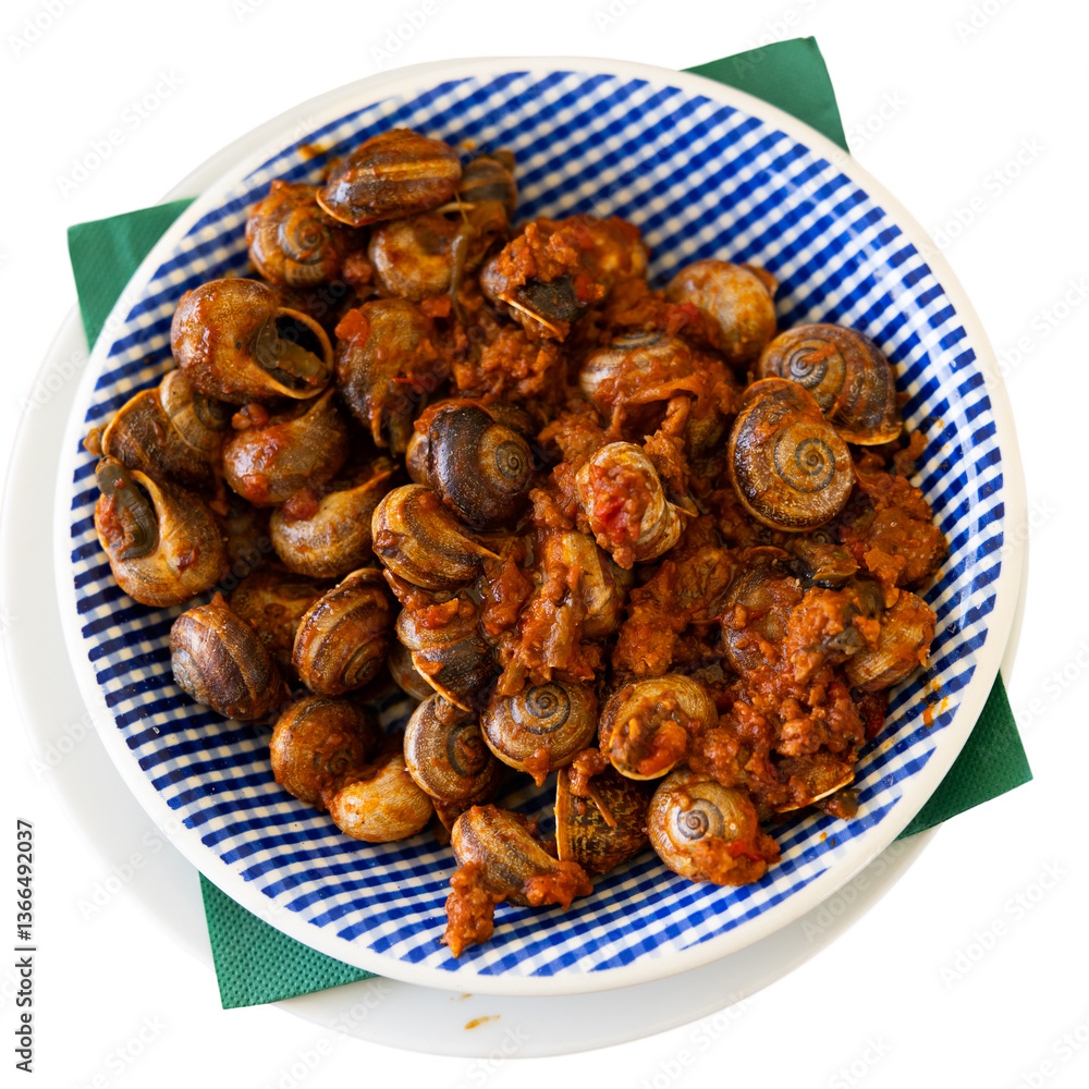 On wooden table there is plate filled to brim with boiled snails. Shellfish snail cooked with minced meat and tomato dressing. Chopsticks are served with food. Isolated over white background On wooden table there is plate filled to brim with boiled snails. Shellfish snail cooked with minced meat and tomato dressing. Chopsticks are served with food. Isolated over white background