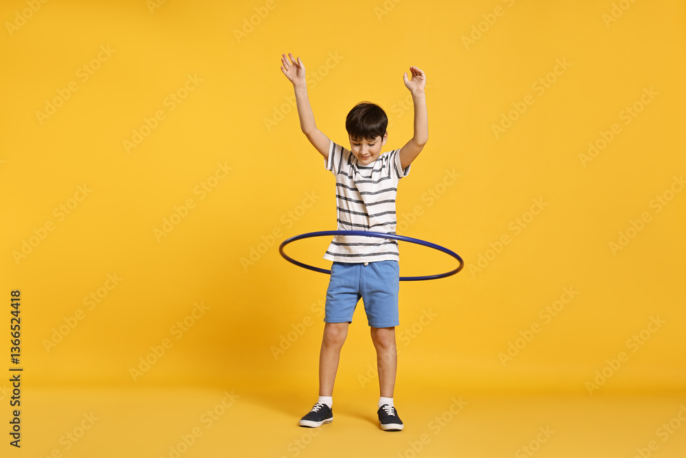 Photography Poster Boy exercising with hula hoop on yellow