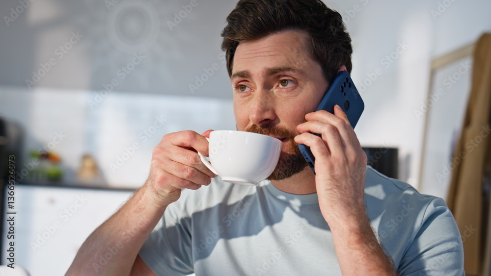Guy hand taking coffee cup calling smartphone in morning closeup. Man talking Guy hand taking coffee cup calling smartphone in morning closeup. Man talking
