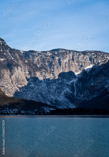 Bright sunny winter day, Alps, Hallstatt lake and village view.