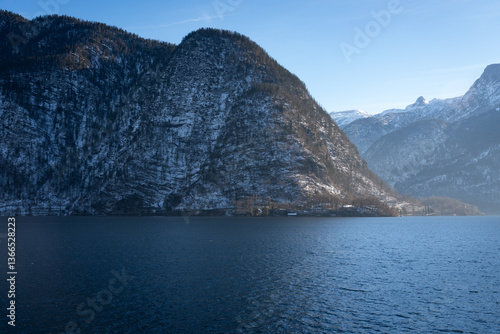 Bright sunny winter day, Alps, Hallstatt lake and village view.