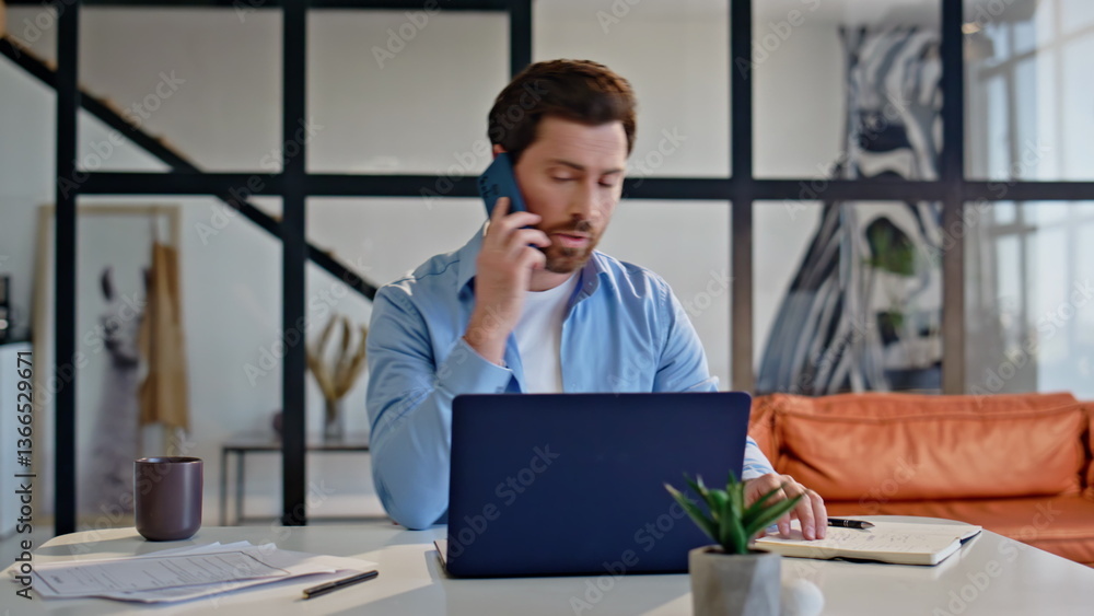 Focused manager calling smartphone sitting office closeup. Boss examining papers Focused manager calling smartphone sitting office closeup. Boss examining papers