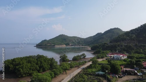 The beauty of Christo Rei Beach and Fatucama Hill seen from a height, one of the most famous tourist destinations in Dili City, Timor Leste.
