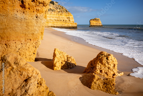 Beautiful empty Praia da Marinha with golden sand. Famous idyllic beach of the Algarve region, Portugal, Europe.