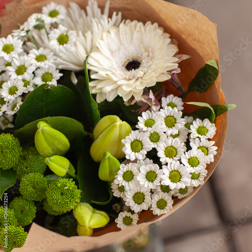 Wallpaper Mural Wrapped bouquet of green and white flowers, .Spring bouquet close-up in craft paper. Floral wallpaper. Torontodigital.ca