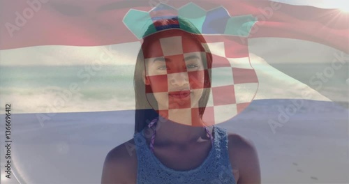 At beach, woman with Croatian flag animation overlay on her face