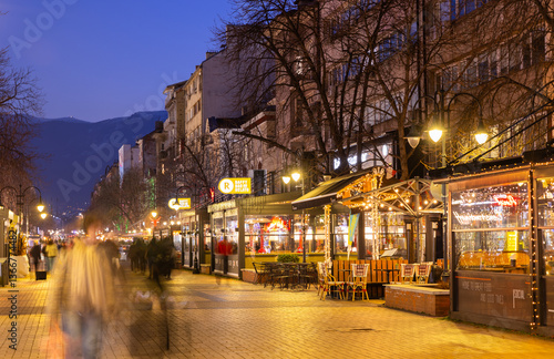 SOFIA, BULGARIA - FEBRUARY 11, 2025: Local people walk in Vitosha Boulevard in the evening. Sofia,
