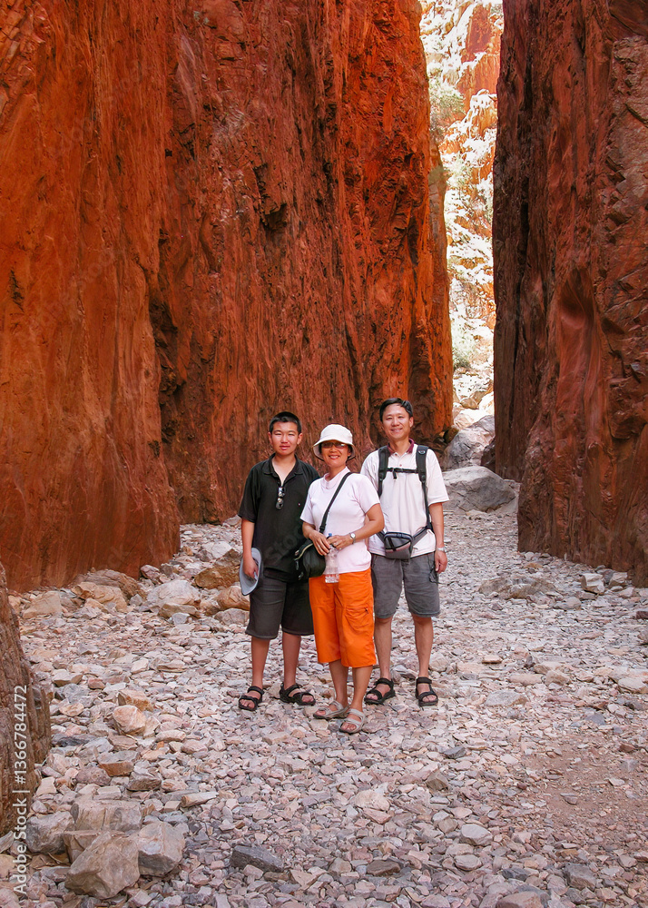 Tourists posing for photos at Standley Chasm. West MacDonnell National Park. Northern Territory. Australia.