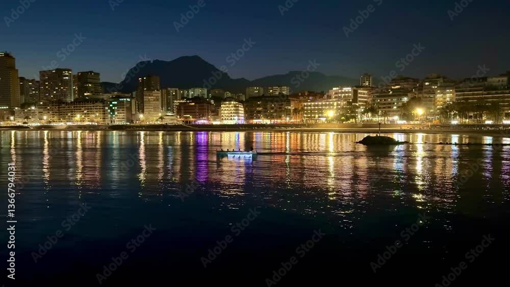 A breathtaking view of the vibrant waterfront city, beautifully illuminated at night, reflecting in calm waters A breathtaking view of the vibrant waterfront city, beautifully illuminated at night, reflecting in calm waters