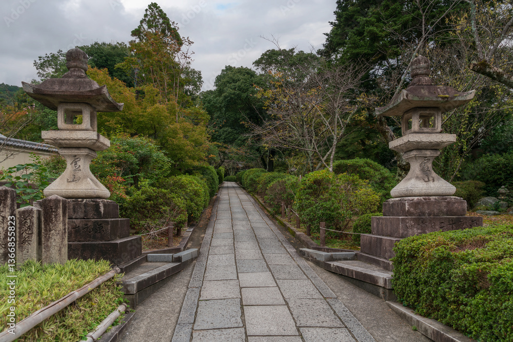 Stone Lanterns (ishi-dore) on the territory of the Kiyomizu-dera Buddhist Temple on the mount Otowa on an autumn day, Kyoto, Japan Stone Lanterns (ishi-dore) on the territory of the Kiyomizu-dera Buddhist Temple on the mount Otowa on an autumn day, Kyoto, Japan