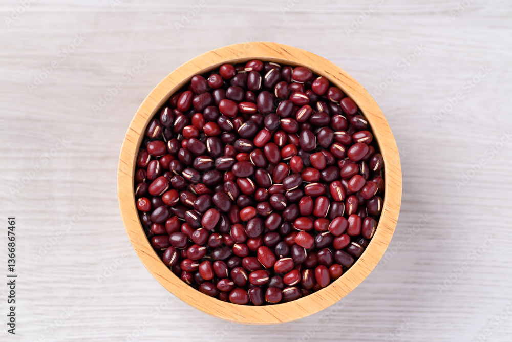 Azuki beans or red mung beans in wooden bowl on white background, Food ingredient, Top view Azuki beans or red mung beans in wooden bowl on white background, Food ingredient, Top view