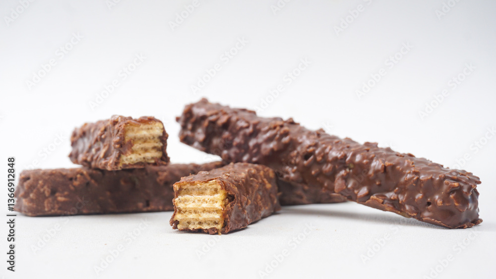 Chocolate caramel wafer bars with crunchy layers and rich coating isolated on white background Chocolate caramel wafer bars with crunchy layers and rich coating isolated on white background