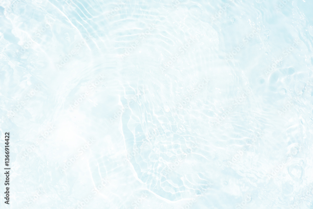 Obraz premium Blue water with ripples on the surface. Defocus blurred transparent blue colored clear calm water surface texture with splashes and bubbles. Water waves with shining pattern texture background.