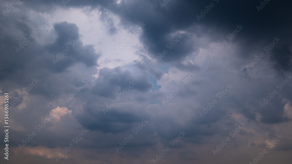 Dark sky with stormy clouds. Dramatic sky rain,Dark clouds before a thunder-storm. Dark sky with stormy clouds. Dramatic sky rain,Dark clouds before a thunder-storm.