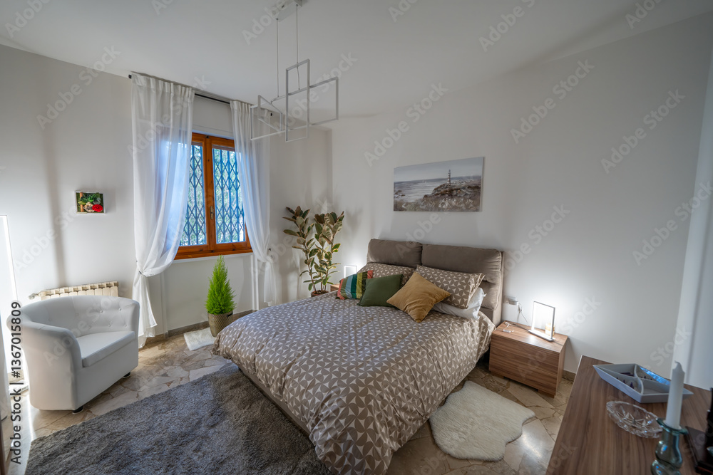 Elegant bed with soft lighting in a modern bedroom