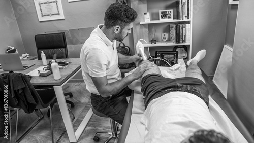 Ultrasound scans a boy's knee. Medical analysis