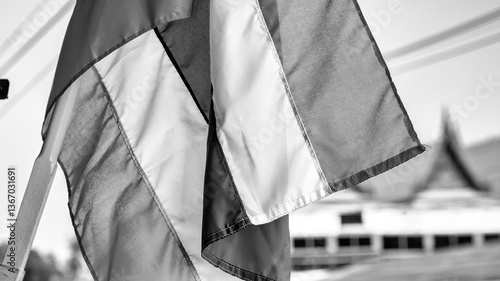Obraz na płótnie Thailand flag fluttering over a traditional floating market with boats and vendors in Thailand w salonie