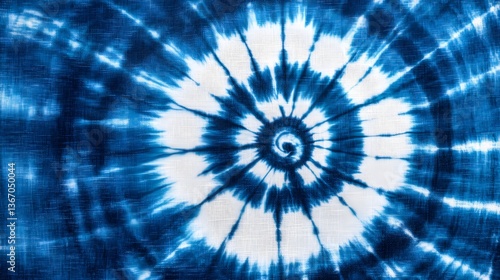 Striking tie dye fabric with a mesmerizing spiral pattern in shades of blue and white creating a dynamic and visually captivating design