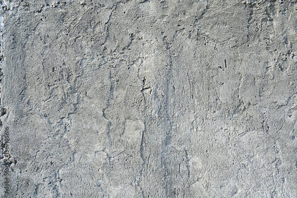 Fototapeta premium Texture of old concrete wall.Concrete wall of light grey color cement texture background.Grey pastel rough crack cement texture stone concrete,rock plastered stucco wall; painted flat fade background.
