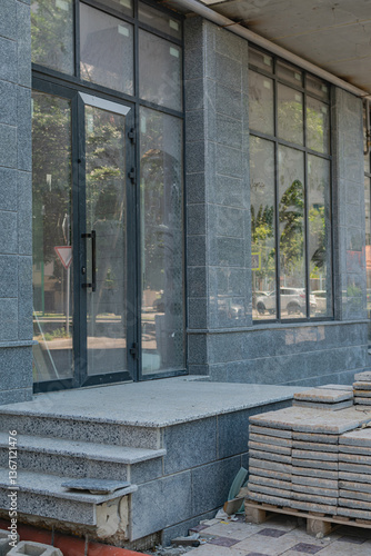 creating a comfortable urban environment. manufacture of paving slabs and other building materials. grey paving slabs stacked in a pile. replacing the old road surface