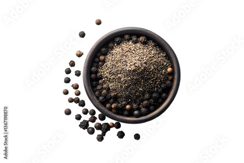 Black peppercorns and ground pepper in a bowl
