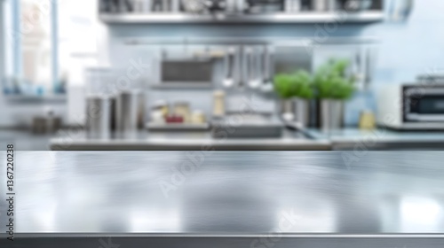 Modern stainless steel table with blurred professional kitchen background for product mockup .

