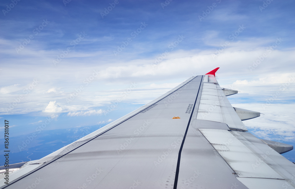 Airplane Wing and Scenic Clouds Viewed During a Flight.. Airplane Wing and Scenic Clouds Viewed During a Flight..