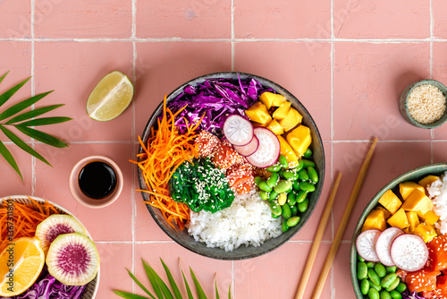 Poke bowl with fresh salmon, mango, legumes, carrots, cabbage, white rice.
