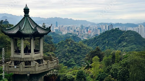 Wallpaper Mural Scenic view overlooking a city skyline from a traditional pavilion on a hill in a lush green landscape Torontodigital.ca