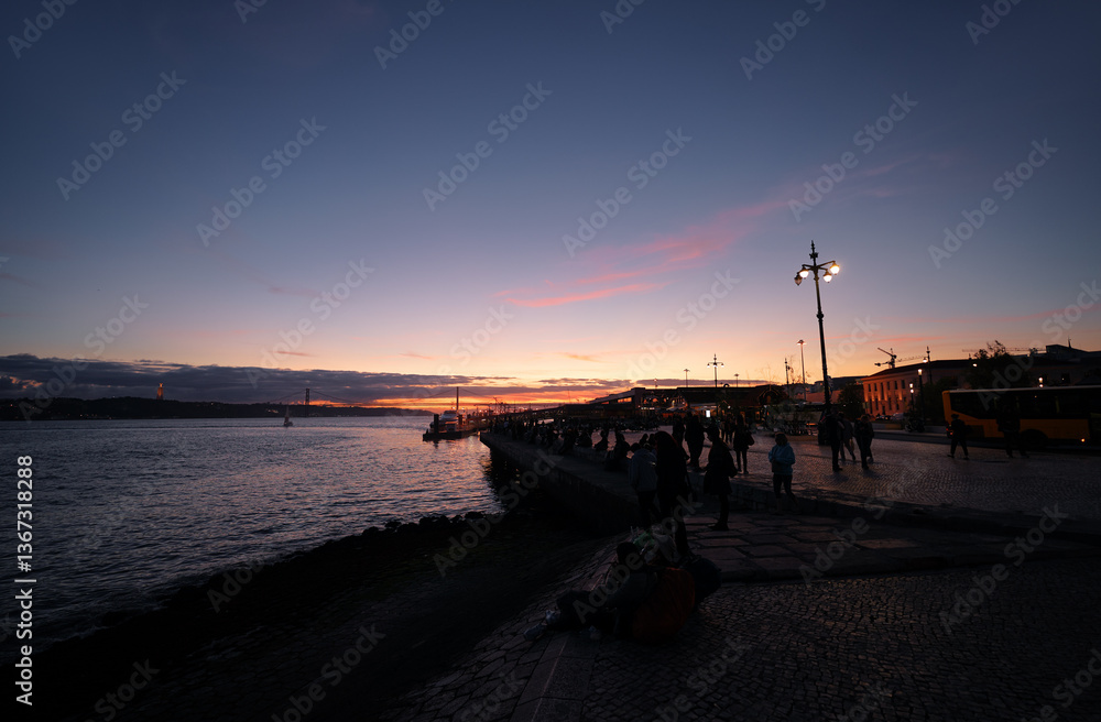 Waterfront promenade in evening time in Lisbon Portugal. Waterfront promenade in evening time in Lisbon Portugal.