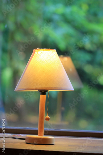 Obraz na płótnie Cozy Lamp by the Window with Serene Ambiance w salonie