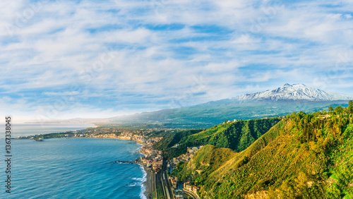 Fototapeta Naklejka Na Ścianę i Meble -  scenic view from above to a beautiful coast with mediterranean touristic town with sea gulf and wonderful coastline and blue cloudy sky on background