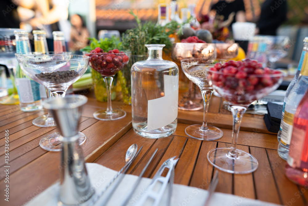 many different ingredients on the bartender's table for making alcoholic cocktails many different ingredients on the bartender's table for making alcoholic cocktails