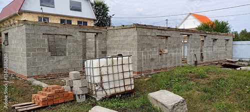 unfinished block walls standing on a brick foundation