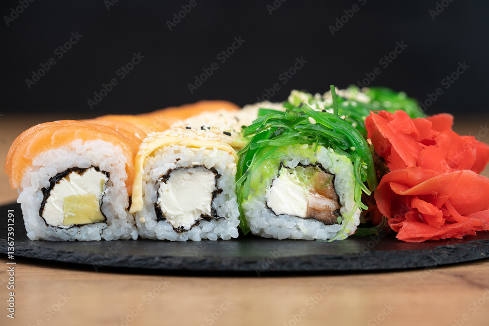delicious traditional Japanese sushi and rolls on a plate delicious traditional Japanese sushi and rolls on a plate