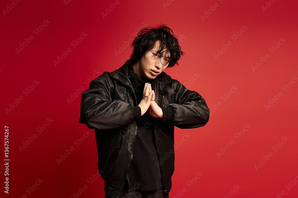 A stylish young man is in a studio A stylish young man is in a studio