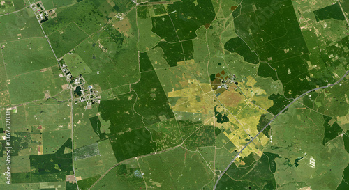 Aerial perspective patchwork, diverse grassland management zones, rural landscape