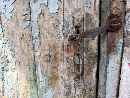 Old rusty door lock on an old wooden door