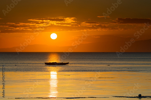 Serene Sunset Over Calm Ocean with Silhouette of Lonely Boat