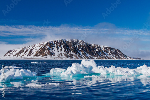 A view of ice-covered Phippsoya, the largest of the Sjuoyane Islands in the Svalbard Archipelago, Norway
