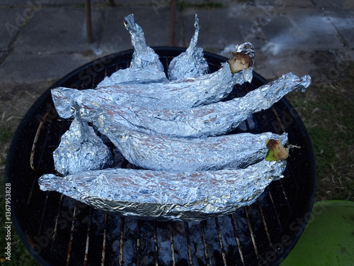 Obraz na płótnie Bananas and chocolate cooked in aluminium foil. Campfire Chocolate Bananas the Ultimate Camping Dessert w salonie