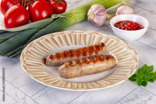 Grilled pork sausages served tomato sauce