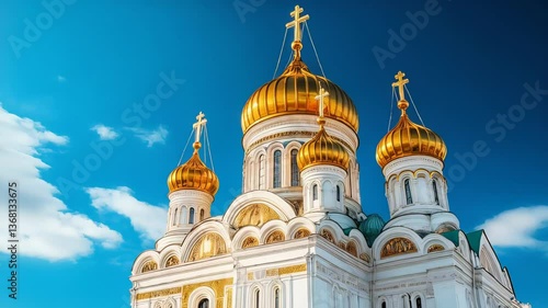 Cathedral of christ the savior, moscow, russia, on a sunny day against a bright blue sky with white clouds at daytime, showing the golden domes