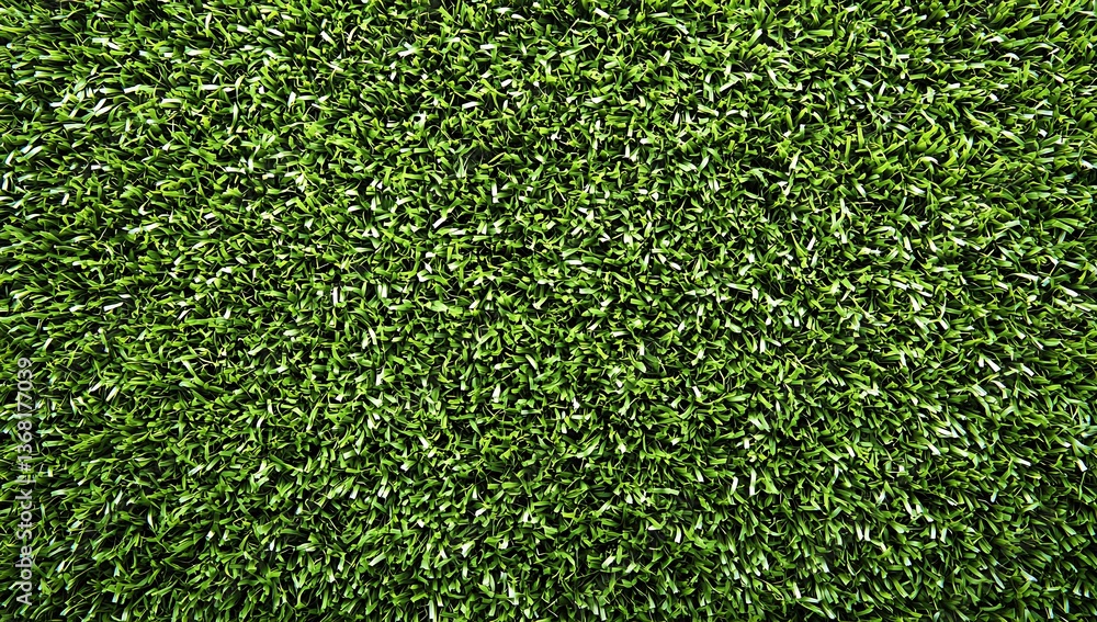 Fototapeta premium close up shot of vibrant green artificial turf creating a uniform and textured surface