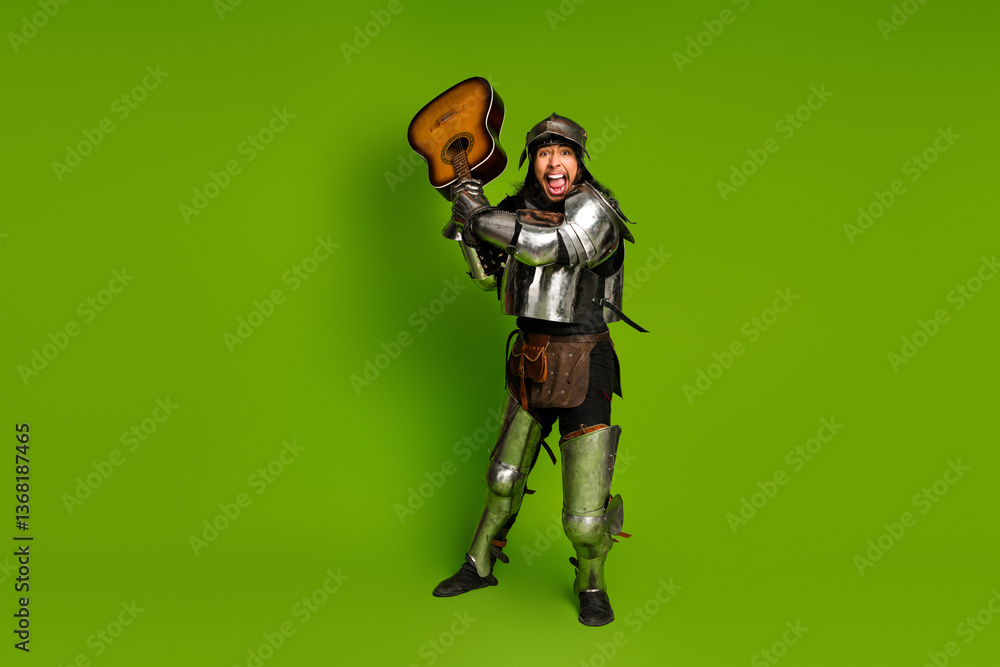 Naklejka premium Funny knight in antique armor playing a guitar against a green background