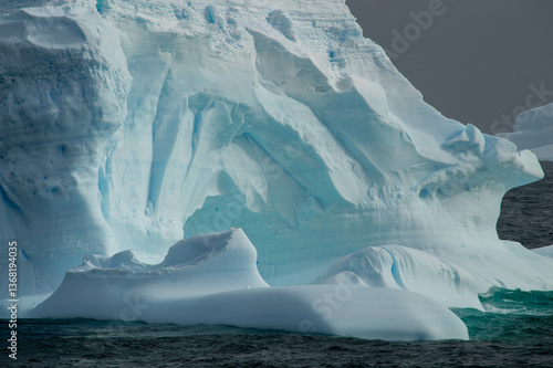 beautiful withe and blue Iceberg closeup photo. Glaciers melting due climate change 