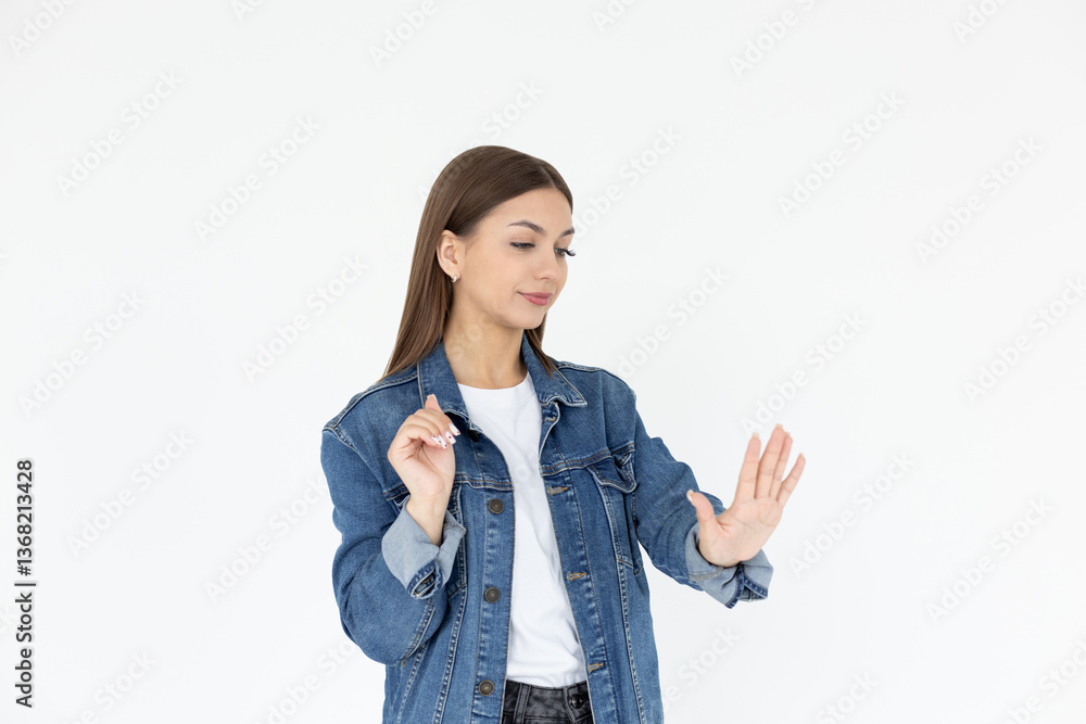 Young caucasian woman looking at manicure on white background Young caucasian woman looking at manicure on white background