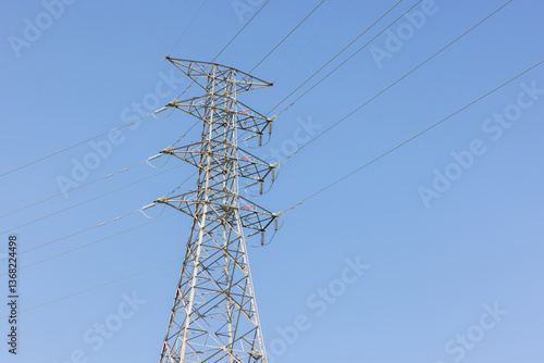 Obraz na płótnie Powerline tower with clear blue sky background w salonie
